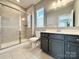 Bathroom featuring tiled floors, modern vanity with a shower over the bath at 9677 Garamont Nw Pkwy, Concord, NC 28027