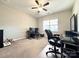 Bedroom featuring a ceiling fan, large window and desk area with gaming setup at 9677 Garamont Nw Pkwy, Concord, NC 28027