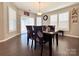Well-lit dining room featuring a modern table set and beautiful window shutters at 9677 Garamont Nw Pkwy, Concord, NC 28027