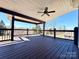 Spacious covered porch with views of the surrounding landscape, perfect for outdoor enjoyment and relaxation at 9677 Garamont Nw Pkwy, Concord, NC 28027