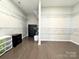 Massive walk-in closet offers ample storage with wire shelving and hardwood floors at 9677 Garamont Nw Pkwy, Concord, NC 28027