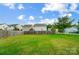 Spacious backyard with a large green lawn and privacy fence at 9704 Cayenne Dr, Charlotte, NC 28214