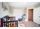 Lovely Bedroom with a crib, a small chair, and a large closet perfect for growing children at 9704 Cayenne Dr, Charlotte, NC 28214