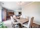 Open concept dining room with wood floors adjacent to kitchen and living room at 9704 Cayenne Dr, Charlotte, NC 28214