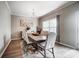 Bright and airy dining room with wood floors and chandelier over the dining table at 9704 Cayenne Dr, Charlotte, NC 28214