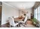 Cozy dining room with elegant chandelier and wood floors at 9704 Cayenne Dr, Charlotte, NC 28214