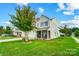 Two-story home with a green lawn at 9704 Cayenne Dr, Charlotte, NC 28214