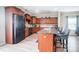 Featuring a large island with bar seating, wood floors, and stainless steel appliances at 9704 Cayenne Dr, Charlotte, NC 28214
