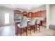 Well-lit kitchen featuring a center island with bar stool seating and stainless steel appliances at 9704 Cayenne Dr, Charlotte, NC 28214