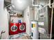 Well-organized laundry room with red washer and dryer and plenty of storage space at 9704 Cayenne Dr, Charlotte, NC 28214