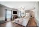 Bright living room with hardwood floors, ceiling fan, and stylish furnishings at 9704 Cayenne Dr, Charlotte, NC 28214