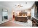 The primary bedroom has a ceiling fan and large windows for natural light at 9704 Cayenne Dr, Charlotte, NC 28214