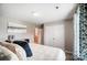 Bright main bedroom features a plush bed, neutral color scheme, and large closet at 9704 Cayenne Dr, Charlotte, NC 28214