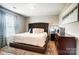Serene main bedroom featuring plush carpets, natural lighting, and tasteful decor at 9704 Cayenne Dr, Charlotte, NC 28214