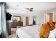 The primary bedroom has a ceiling fan and large windows for natural light at 9704 Cayenne Dr, Charlotte, NC 28214