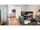 Bright office with hardwood floors that opens to a Gathering room and kitchen provides a warm atmosphere at 9704 Cayenne Dr, Charlotte, NC 28214