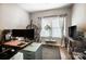 Sunlit office with large window, a hanging chair and hardwood floors at 9704 Cayenne Dr, Charlotte, NC 28214