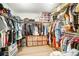 Walk-in closet with ample storage shelves and racks offers exceptional organization at 9704 Cayenne Dr, Charlotte, NC 28214