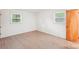 Bright bedroom featuring hardwood floors and two windows at 9907 Hagers Rd, Huntersville, NC 28078
