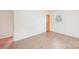 Bright bedroom with hardwood floors, white walls, and natural light at 9907 Hagers Rd, Huntersville, NC 28078