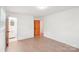 Bright, hardwood floor bedroom featuring a view into the bathroom at 9907 Hagers Rd, Huntersville, NC 28078
