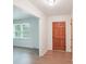 Welcoming foyer featuring wood-look floors, and a view into the living area creating a warm and inviting entry at 9907 Hagers Rd, Huntersville, NC 28078
