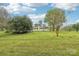 Sprawling lawn features lush greenery and a painted brick ranch home at 9907 Hagers Rd, Huntersville, NC 28078