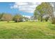 Enjoy this peaceful backyard with its lush greenery and rear home elevation at 9907 Hagers Rd, Huntersville, NC 28078