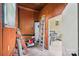 Utility room with an electric water heater and a view to the patio at 9907 Hagers Rd, Huntersville, NC 28078