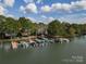 Aerial view of community boat slips at The Woods at Lake Davidson on a beautiful day at 108 Kinderston Dr, Davidson, NC 28036