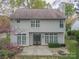 A backyard with a patio, a fire pit, and a lush lawn providing ample space for outdoor activities and relaxation at 108 Kinderston Dr, Davidson, NC 28036