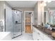 Bathroom featuring marble floors, a glass walk-in shower, and a bronze faucet sink with wood counters at 108 Kinderston Dr, Davidson, NC 28036