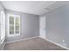 Simple bedroom with neutral carpet, gray walls and white trim at 108 Kinderston Dr, Davidson, NC 28036