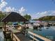 Community boat slip with covered seating area on a sunny day at The Woods at Lake Davidson at 108 Kinderston Dr, Davidson, NC 28036