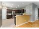 Well-lit kitchen with stainless steel appliances, brown cabinetry, and a tile backsplash at 108 Kinderston Dr, Davidson, NC 28036