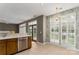 Eat-in kitchen space with stainless steel appliances and lovely windows and doors with white shutters at 108 Kinderston Dr, Davidson, NC 28036
