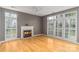 Spacious living room with fireplace, hardwood floors and lovely windows at 108 Kinderston Dr, Davidson, NC 28036