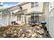 View of private backyard with patio, outdoor furniture, and mature trees, creating a relaxing space at 10920 Walking Path Ln, Charlotte, NC 28213