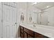 Clean bathroom features a vanity with a white countertop and large mirror at 10920 Walking Path Ln, Charlotte, NC 28213