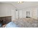 Spacious bedroom featuring neutral carpet, vaulted ceilings, and a large closet at 10920 Walking Path Ln, Charlotte, NC 28213