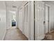 Hallway features a bedroom doorway and multiple closets for optimal storage at 10920 Walking Path Ln, Charlotte, NC 28213