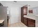 Bright kitchen with stainless steel appliances, dark cabinets, and tiled flooring at 10920 Walking Path Ln, Charlotte, NC 28213