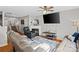 Inviting living room featuring a fireplace, plush seating, and hardwood floors at 10920 Walking Path Ln, Charlotte, NC 28213