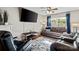 Cozy living room with hardwood floors, a large window, and comfortable seating at 10920 Walking Path Ln, Charlotte, NC 28213