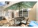 Cozy outdoor patio featuring dining set, grill and view of the property's exterior at 10920 Walking Path Ln, Charlotte, NC 28213