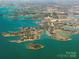 Captivating aerial view of a scenic lake area with numerous islands, peninsulas, and waterfront properties at 110 Lantern Acres Dr, Mooresville, NC 28115