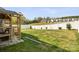 Spacious backyard with a white fence and a view of surrounding homes and greenery at 110 Lantern Acres Dr, Mooresville, NC 28115