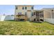 Large backyard featuring a wooden pergola and a screened-in porch, ideal for outdoor living at 110 Lantern Acres Dr, Mooresville, NC 28115