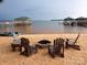 Beach setup including chairs and a fire pit, for relaxing lakefront living at 110 Lantern Acres Dr, Mooresville, NC 28115