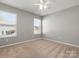 Cozy bedroom with natural light and neutral carpet at 110 Lantern Acres Dr, Mooresville, NC 28115